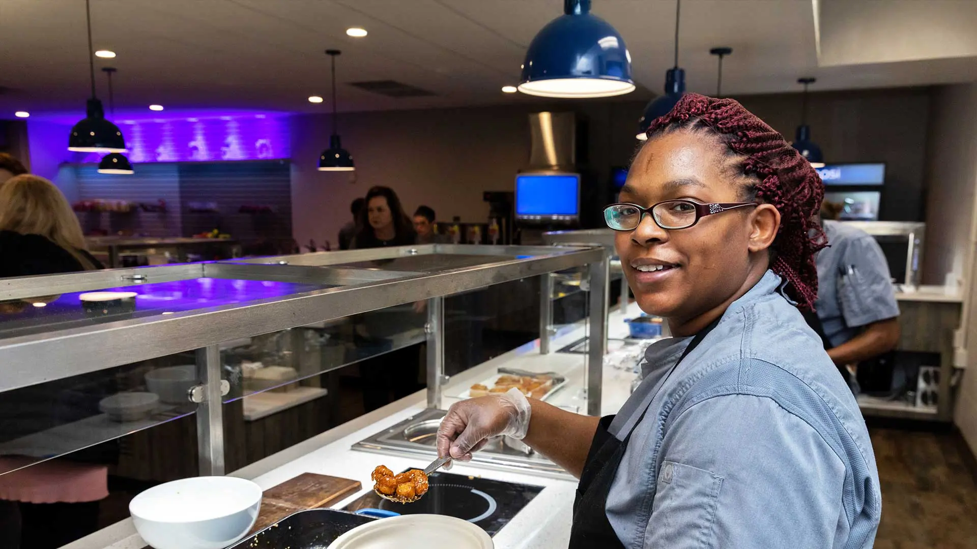 Cooking serving up chicken dish