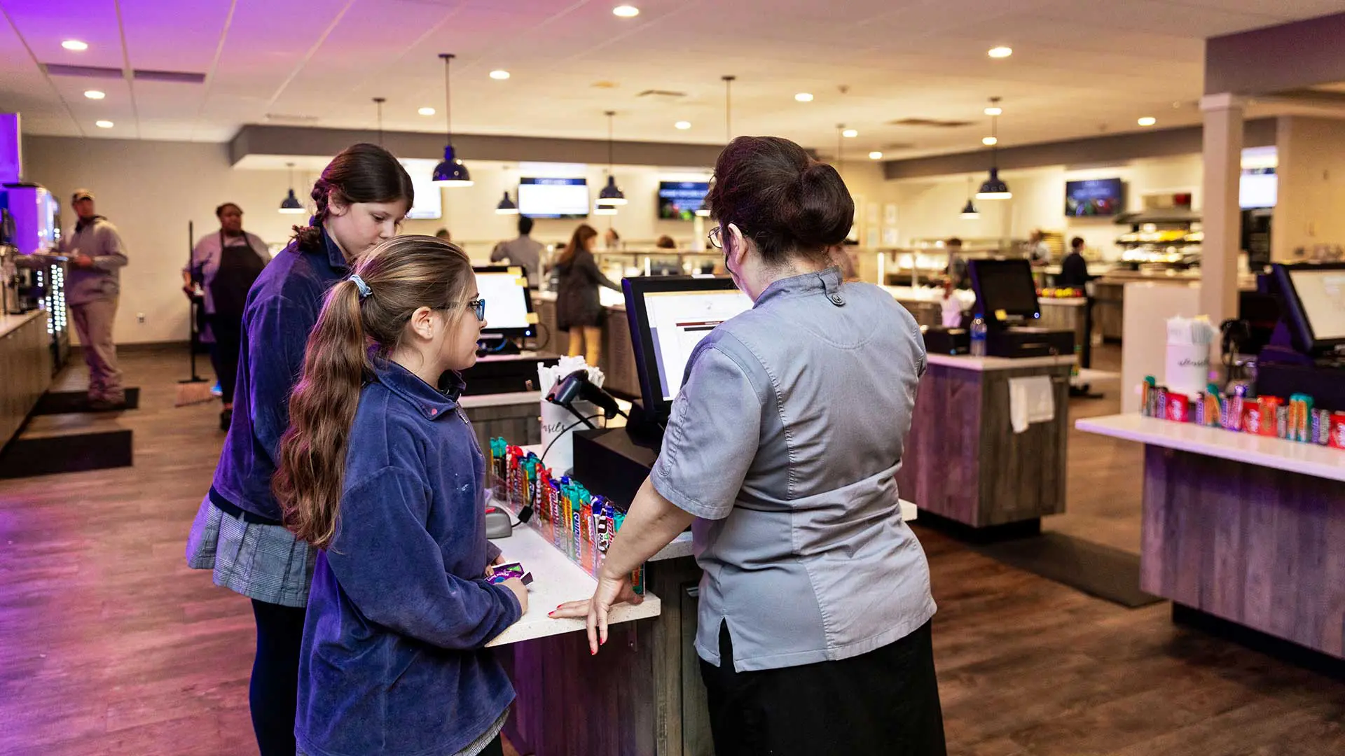 Students checking out at cash register